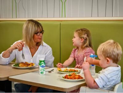 Family of 3 having a meal at Asda café